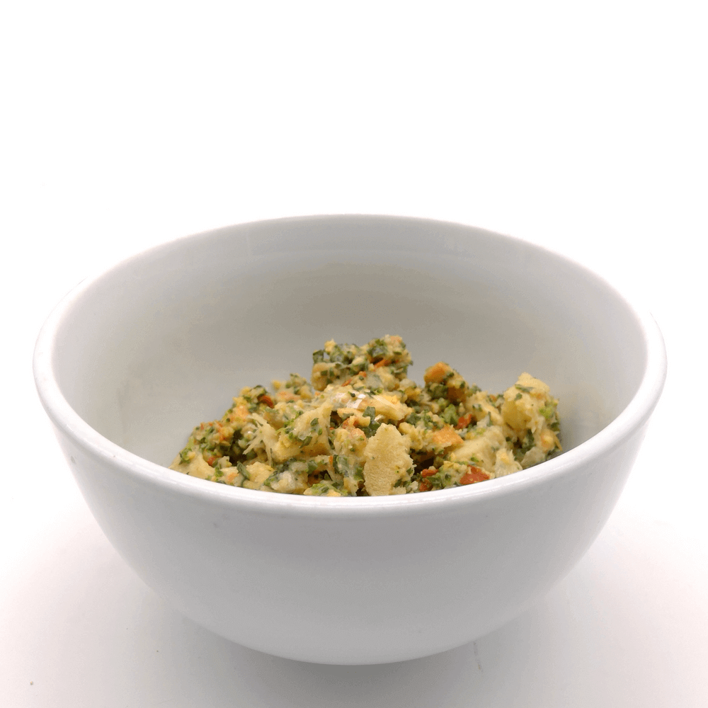 A white bowl filled with Homestyle PetMix dog food, representing the benefits of fish in your dog's menu